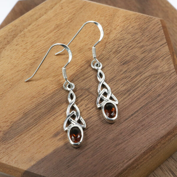 Triquetra Sterling Silver Earrings with garnet stones.
Product Name: Triquetra Sterling Silver Earrings