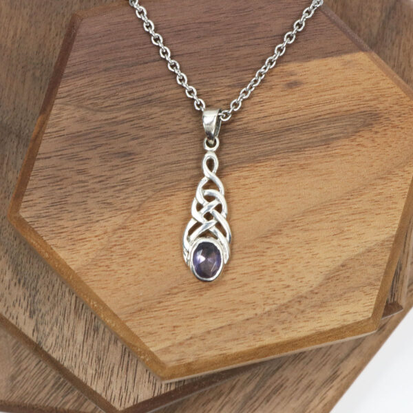 A Amethyst Celtic Knot Necklace with a purple amethyst pendant.