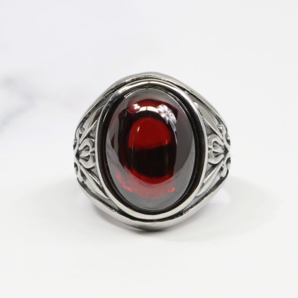 A Dragon's Eye Ring with a red stone.