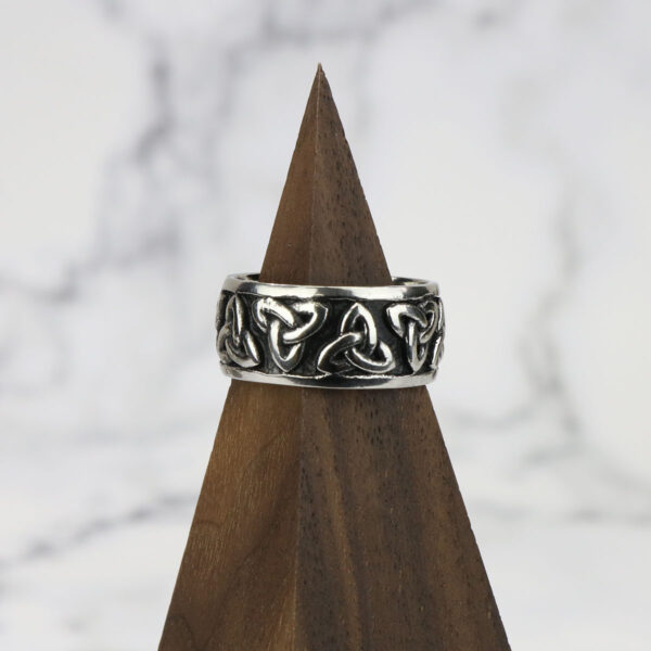 A Two Tone Triquetra Ring with a Celtic triquetra design on it.