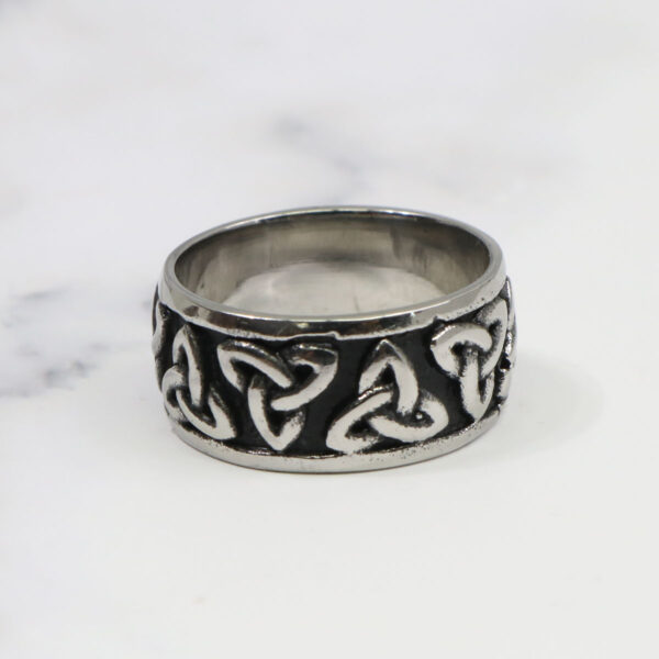 A silver Two Tone Triquetra Ring with celtic knots.