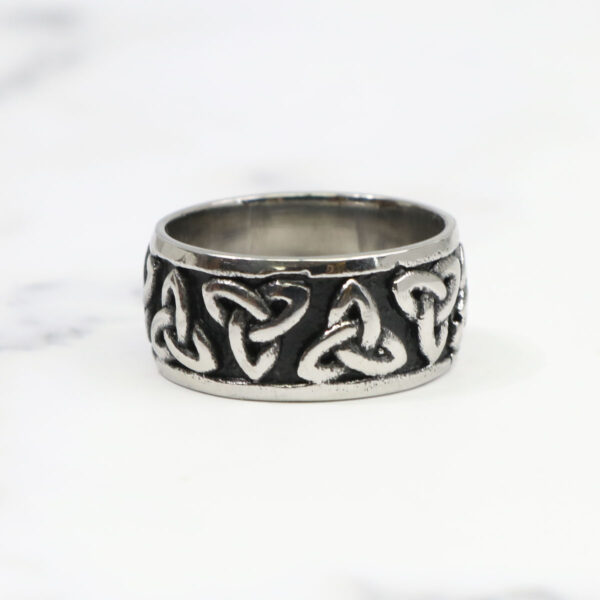 A Two Tone Triquetra Ring with celtic knots and a triquetra design.
