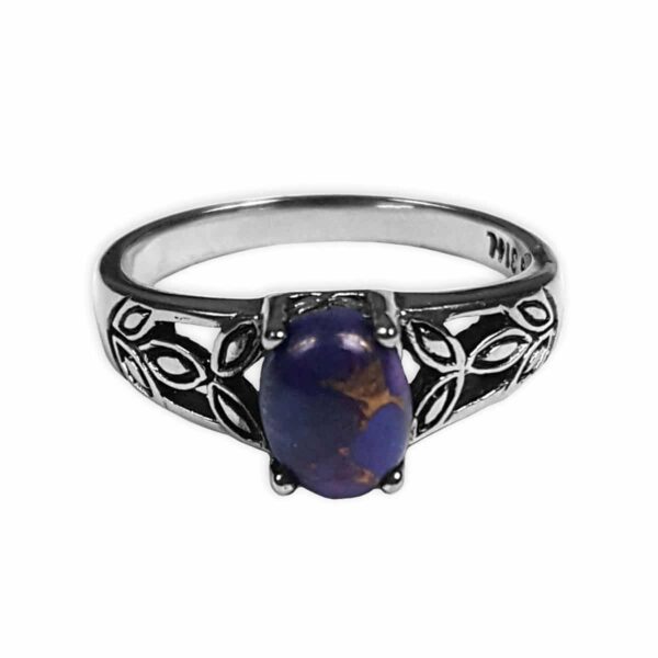 A Purple Mohave Turquoise Triquetra Ring with a blue stone in the center.
