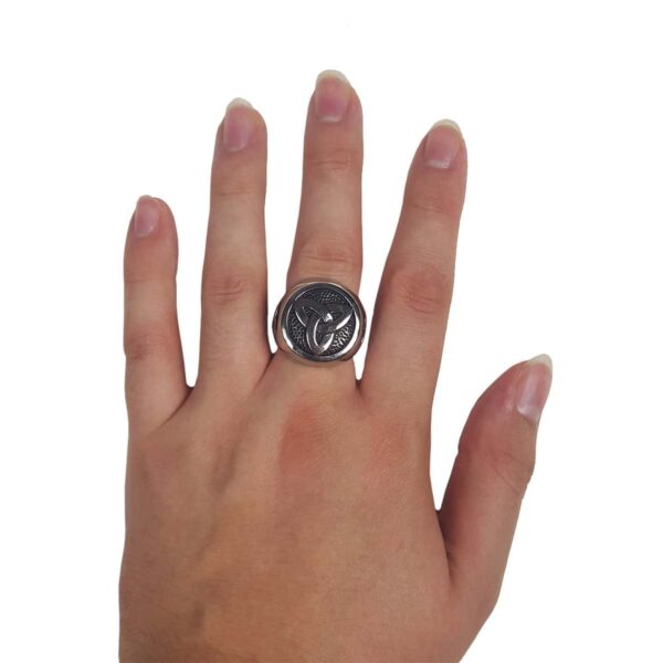 A woman's hand with a Stainless Steel Triple Triquetra Ring.