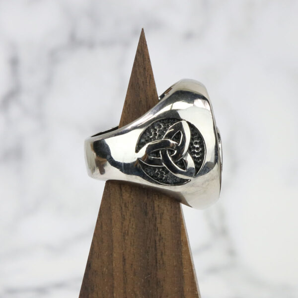 A silver Stainless Steel Triple Triquetra Ring with a celtic knot design.