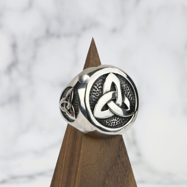 A Stainless Steel Triple Triquetra Ring made of silver.