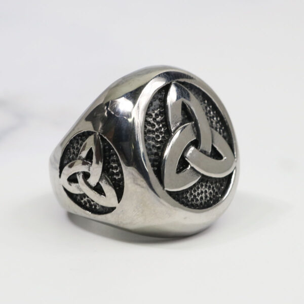 A Stainless Steel Triple Triquetra ring with a celtic knot on it.