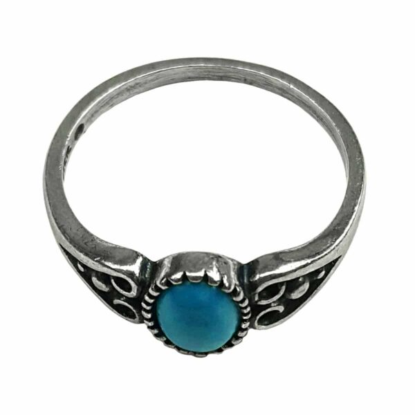 A Celtic Heart Turquoise Sterling Silver Ring with a heart-shaped stone.