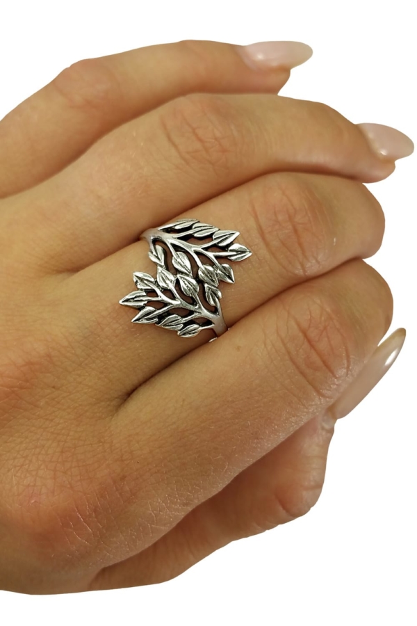 A woman's hand adorned with a Leafy Vines Sterling Silver Ring.
