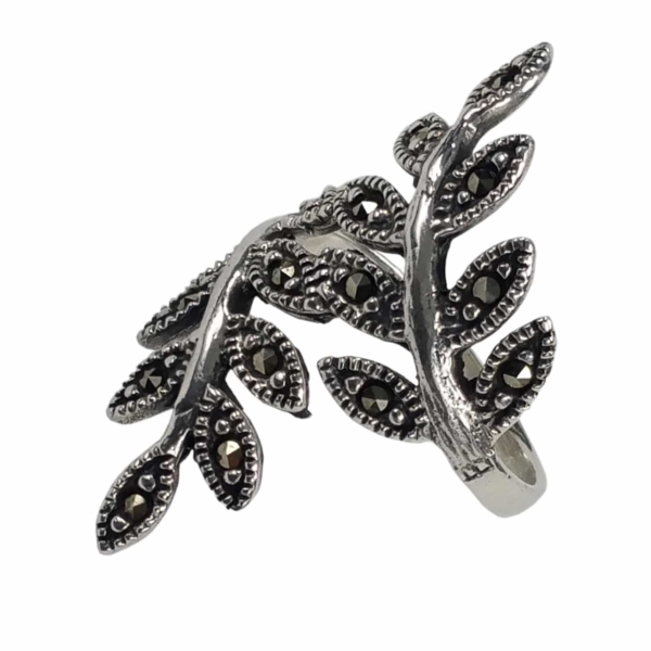A sparkly silver Vines Sterling Silver Ring with black stones.