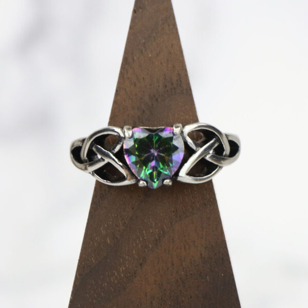 A *Mystic Crystal Celtic Knot Heart Ring* with an amethyst crystal.