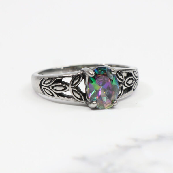 A Mystic Crystal Stainless Steel Ring with a multi colored topaz stone.