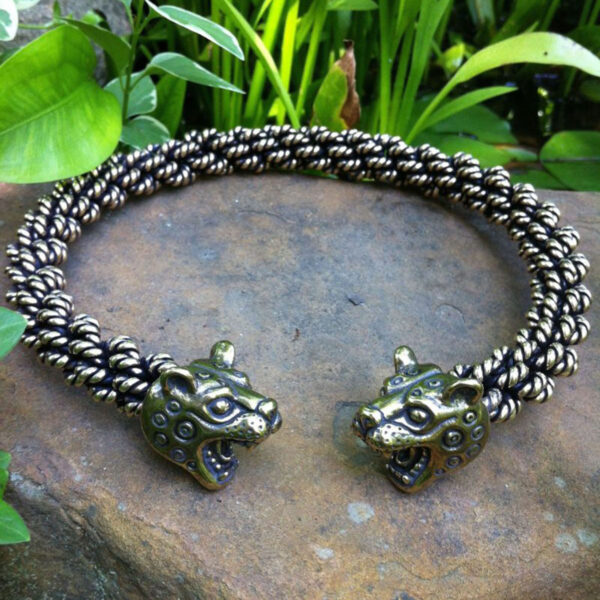 A Leopard Torc - Extra Heavy Braid bracelet with a tiger head on it.