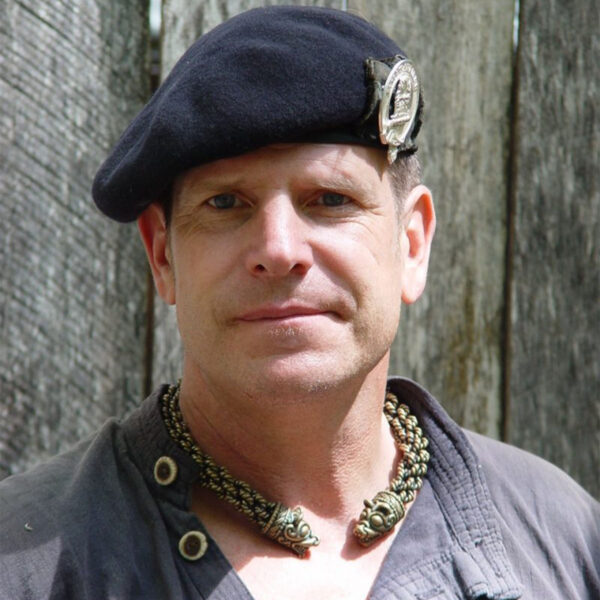 A man wearing a beret and a Norse Bear Torc - Extra Heavy Braid.