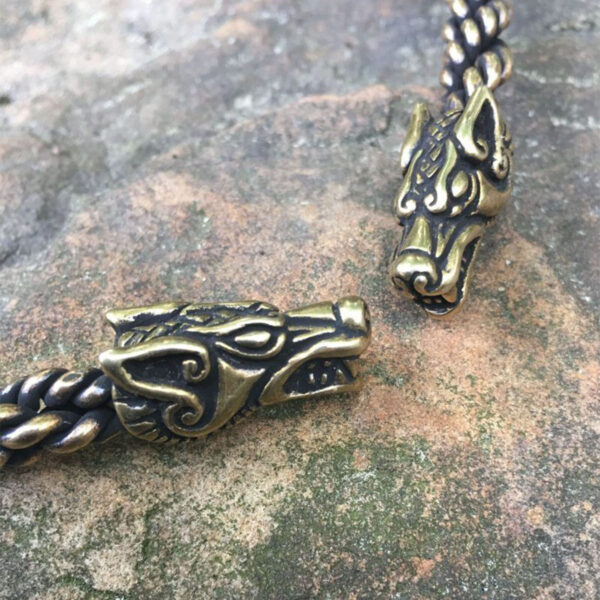 Two Celtic Wolf Neck Torcs on a rock.