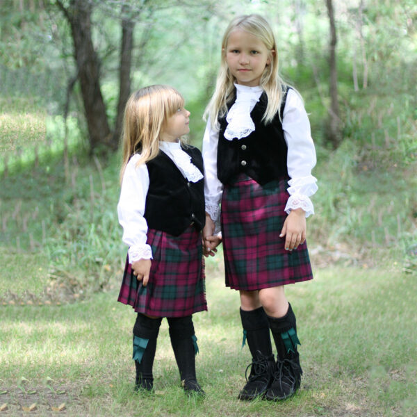 Two Large Ancient Kid Kilts standing in the woods.