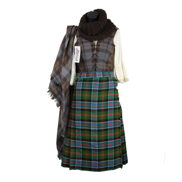 A scottish kilt and scarf on a mannequin.