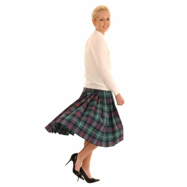 A woman in a Light Weight Deep-Pleated Kilted Skirt is standing on a white background.