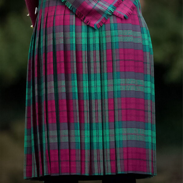 The back of a woman wearing a Welsh Tartan Medium Weight Premium Wool Standard Ladies' Kilted Skirt.