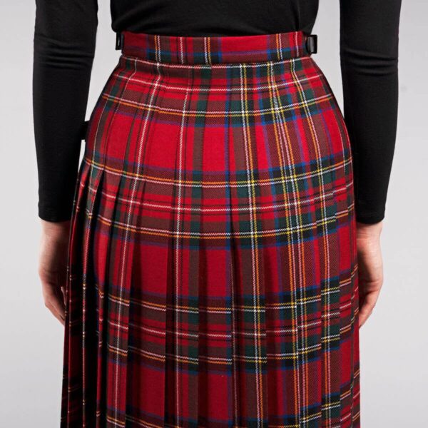 The back view of a woman wearing an Old & Rare Tartans Standard Ladies' Kilted Skirt in a medium weight fabric.