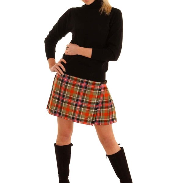 A woman in a plaid skirt posing for a photo wearing a Light Weight Premium Wool Kilted Mini Skirt.
