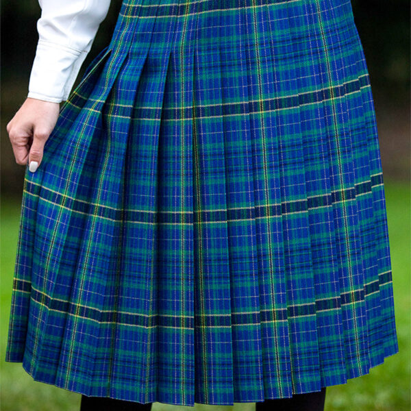 A woman wearing a Welsh Tartan Medium Weight Premium Wool Fiona Kilted Skirt.