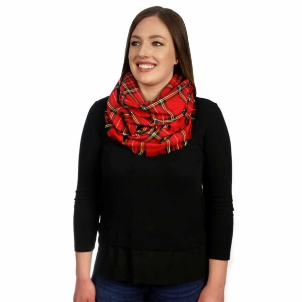 A woman donning a Tartan Infinity Scarf - Poly/Viscose Wool Free.
