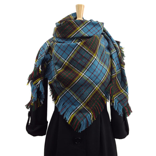 A blue and brown Spring Weight Tartan Shawl on a mannequin.