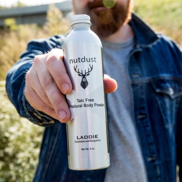 A Nutdust - Laddie with a bottle of body wash.