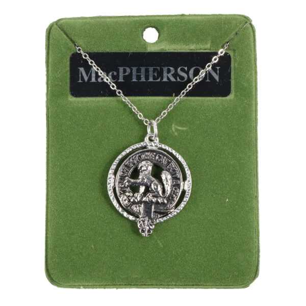 A sterling silver necklace with a scottish kilt on it.
