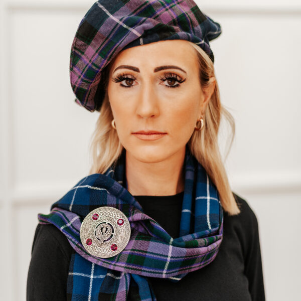 A woman wearing a Quality Wool Blend Kilt with Matching Tartan Flashes and FREE Kilt Hanger, with a touch of homespun.