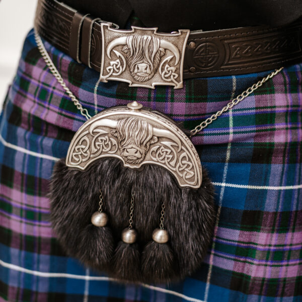 A person wearing a Quality Wool Blend Kilt with Matching Tartan Flashes and FREE Kilt Hanger.