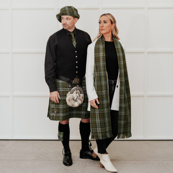 A man and woman sporting the Quality Wool Blend Kilt with Matching Tartan Flashes and FREE Kilt Hanger and hats.