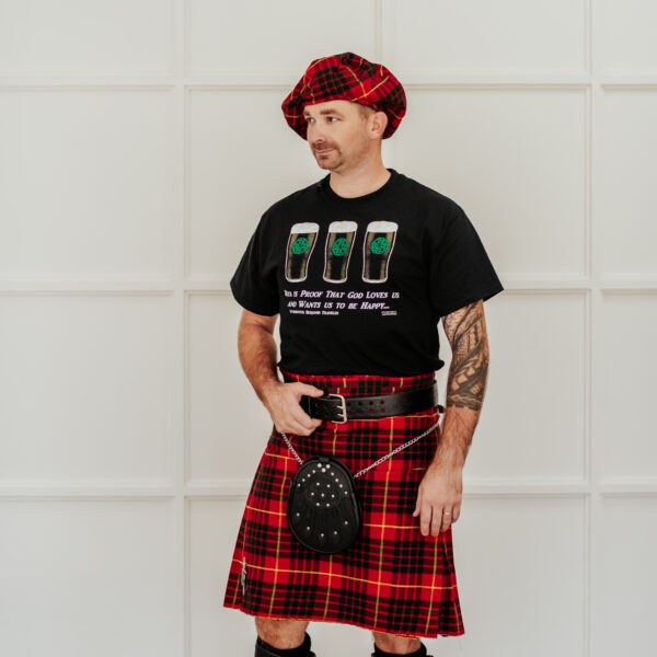 A man in a Quality Wool Blend Kilt with Matching Tartan Flashes and FREE Kilt Hanger.