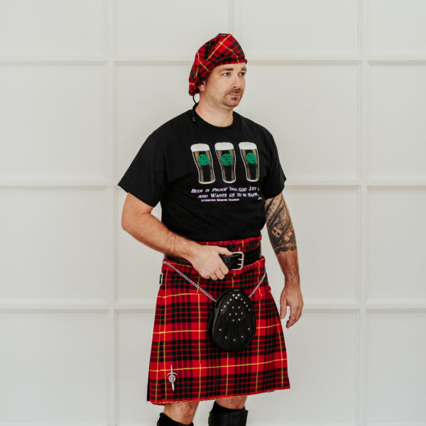 A man in a Quality Wool Blend Kilt with Matching Tartan Flashes and FREE Kilt Hanger.