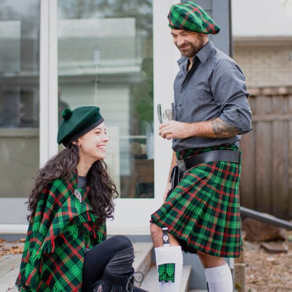 A man and woman dressed in traditional kilts made with homespun wool blend tartan fabric.