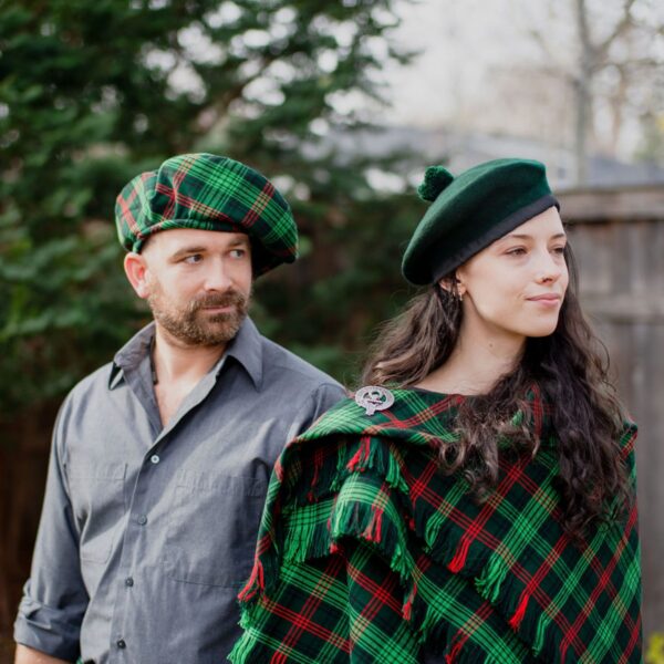 A man and woman dressed in scottish kilts adorned with Homespun Wool Blend Tartan Tam.