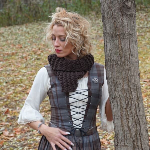 A woman in a renaissance dress leaning against a tree, wearing an OUTLANDER Inspired Custom-Made Hand-Knit Cowl.