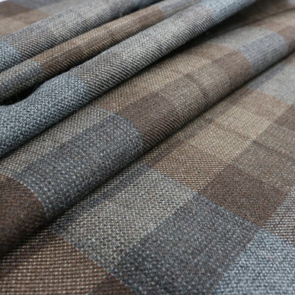 A close up of a brown and blue plaid fabric.