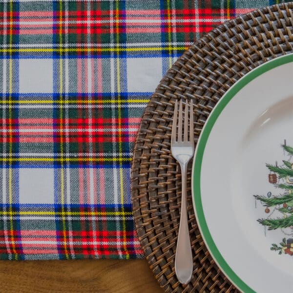 A Reversible Tartan placemat with a christmas tree on it.