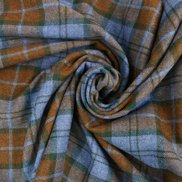 A close up of a blue and brown plaid fabric.