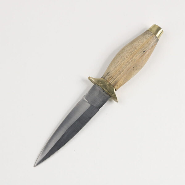 A Rustic Wood Handled Sgian Dubh REJECTS knife on a white surface.