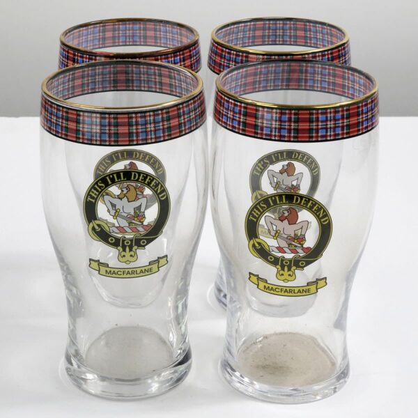 A set of four MacFarlane Clan Crest Tartan Pub Glasses - Set of 4, featuring the MacFarlane Clan and tartan design.