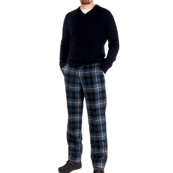 A man wearing Tartan Trousers made of light weight 11oz premium wool fabric.