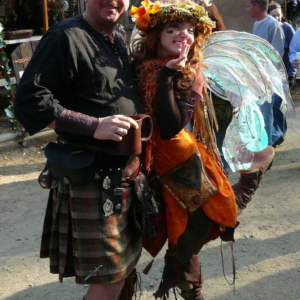 A man and a woman dressed as a fairy.