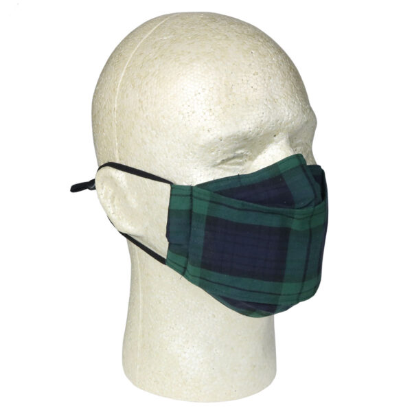A green Origami Tartan Masks - Cotton face mask on a mannequin head.
