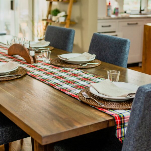 The Reversible Tartan Table Runner - Homespun Wool Blend adds a cozy and homespun touch to any wooden table.