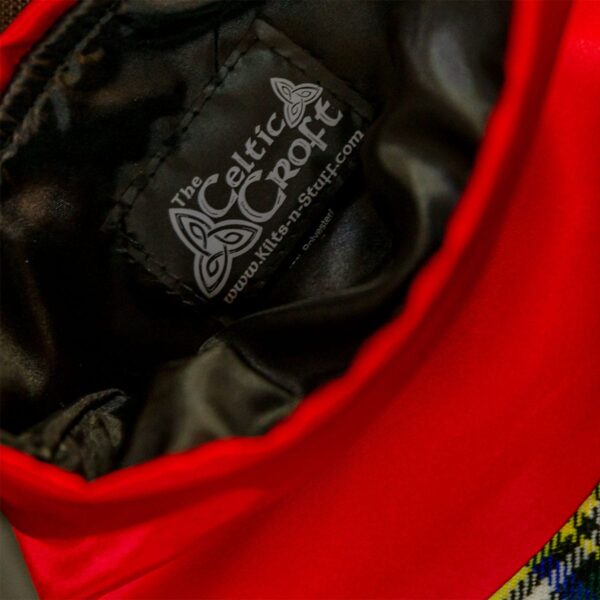 A close up of a red Tartan Stocking - Homespun Wool Blend bag.