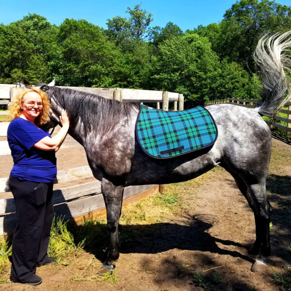 A woman standing next to a horse with an English Style Saddle Pad - Heavy Weight Premium Scottish Wool-NLA.