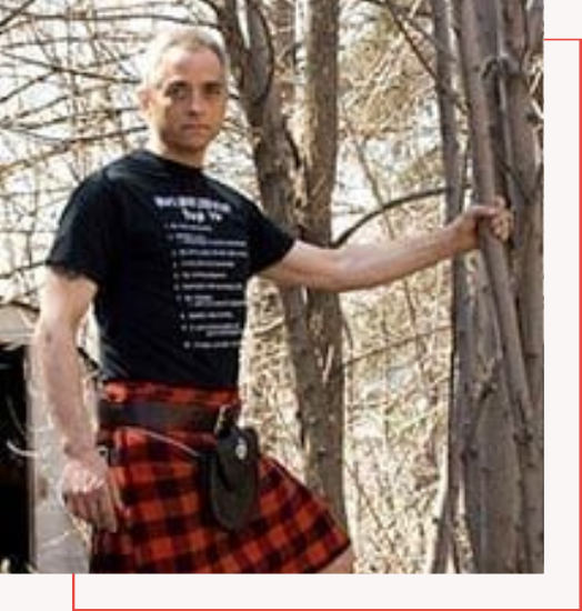 A kilt buyer guide leaning against a tree.